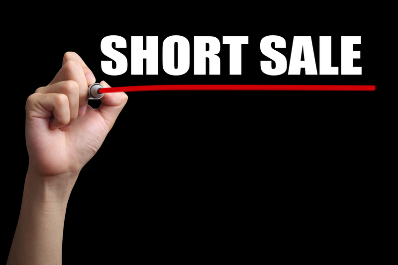 Business person writing short sale