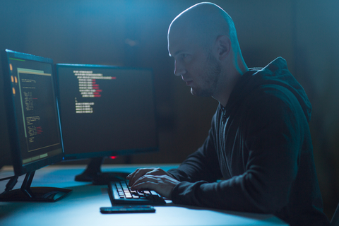 A hacker working at a computer